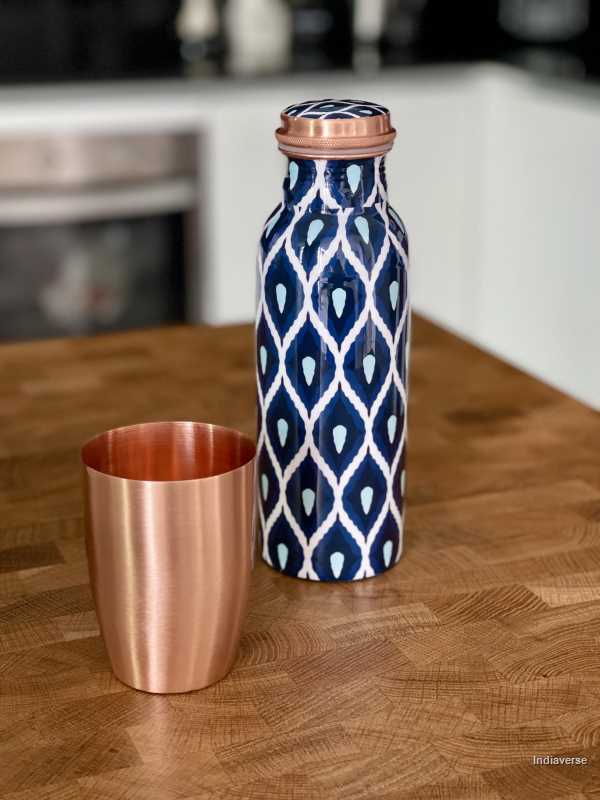 Pure copper bottle with 600 ml capacity and enameled with beautiful blue and white geometrical design and polished pure copper cup perfect for drinking water