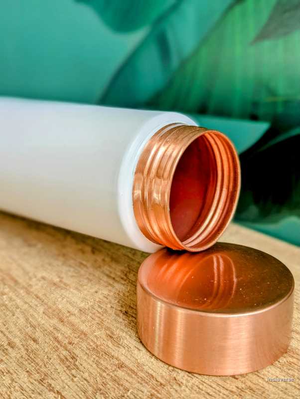 enameled white copper bottle with sleek elegant shape perfect for drinking water and capacity of 900 ml