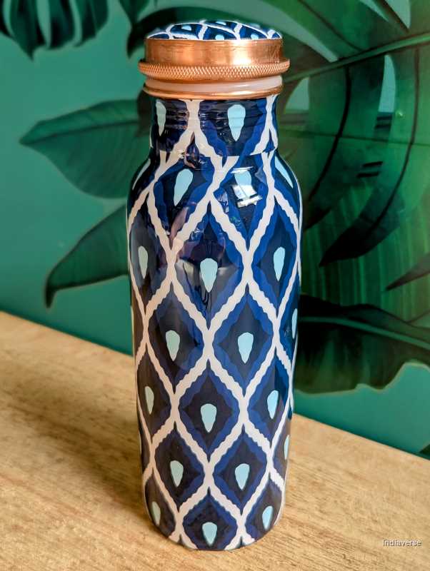 Pure copper bottle with 600 ml capacity and enameled with beautiful blue and white geometrical design perfect for drinking water