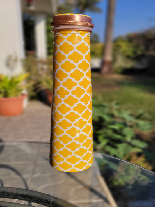copper bottle tower shaped made from copper and enameled with symmetric yellow design for drinking water