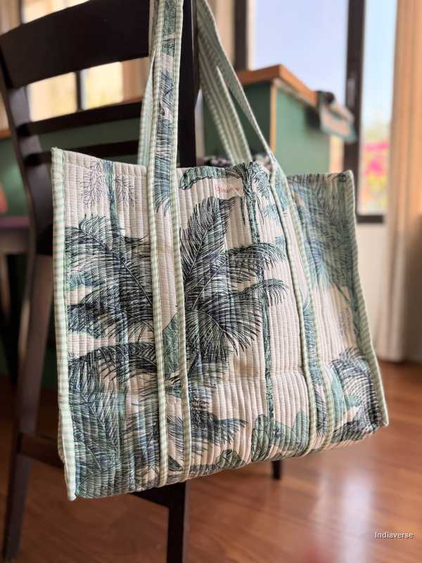 Tote bag with palm tree pattern on a chair