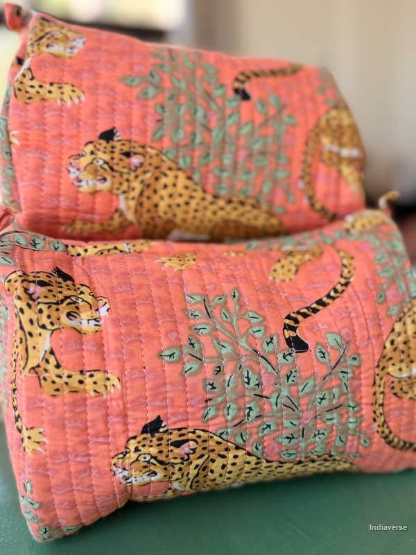 Pink quilt with leopard pattern on a green surface | Peach Leopard