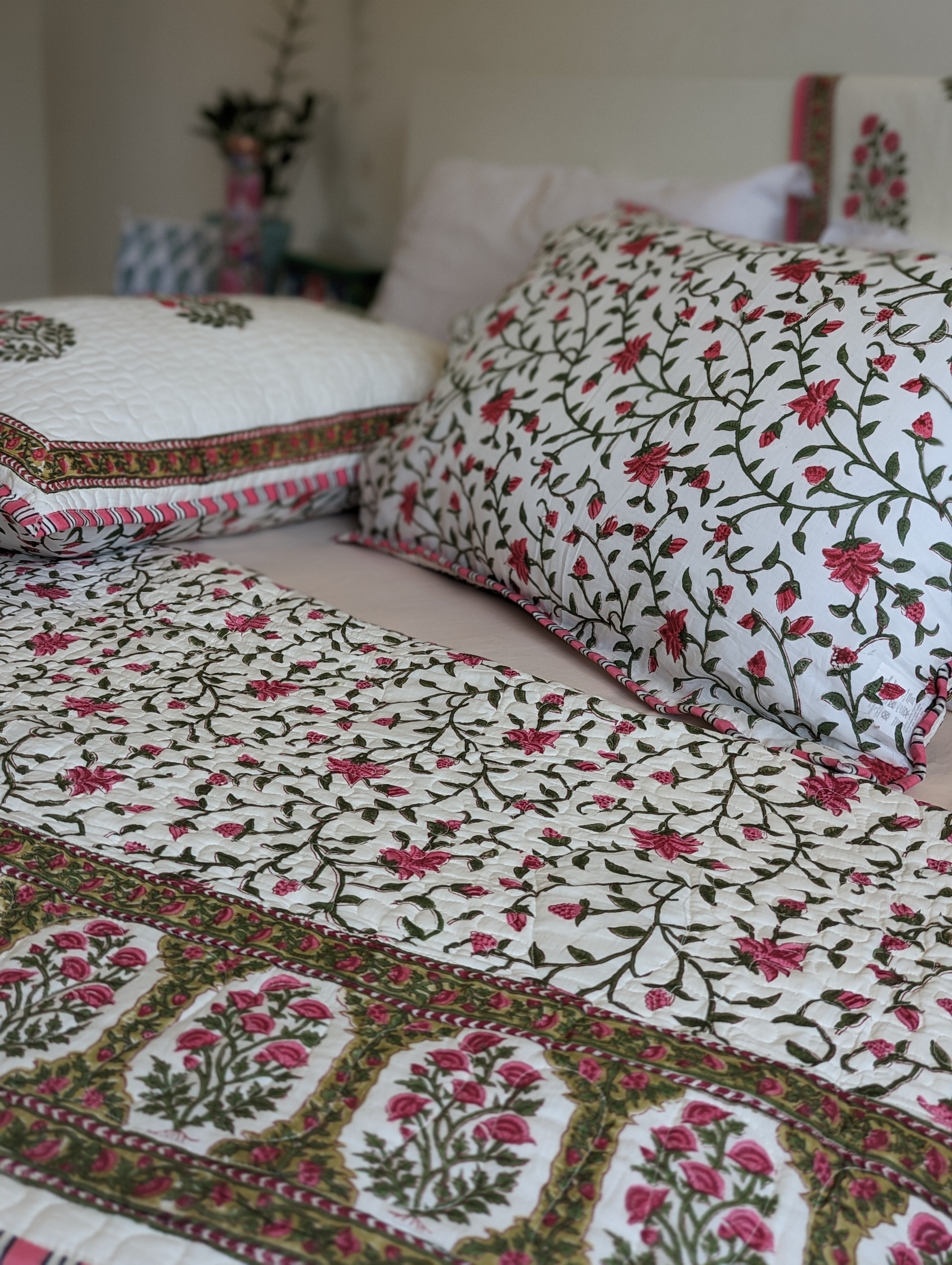 close up view of bedding with hand block printed rose design