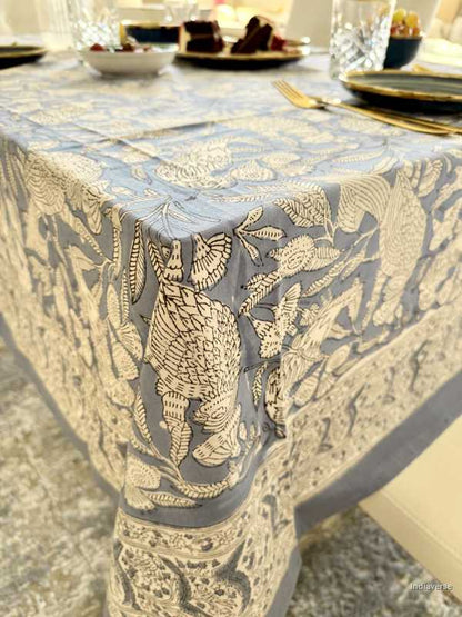 Tablecloth with bird pattern on a dining table corner close up