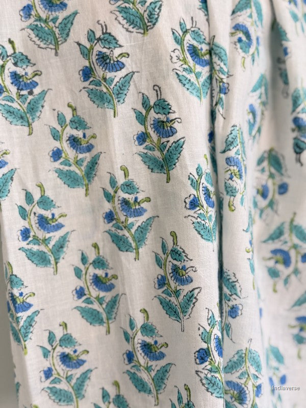 close up of small blue flowers on a cotton scarf
