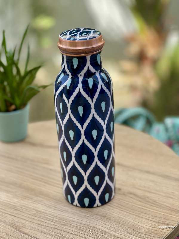 Pure copper bottle with 600 ml capacity and enameled with beautiful blue and white geometrical design perfect for drinking water