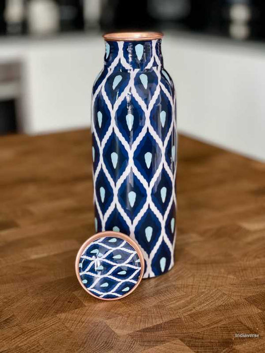 Pure copper bottle with 600 ml capacity and enameled with beautiful blue and white geometrical design perfect for drinking water