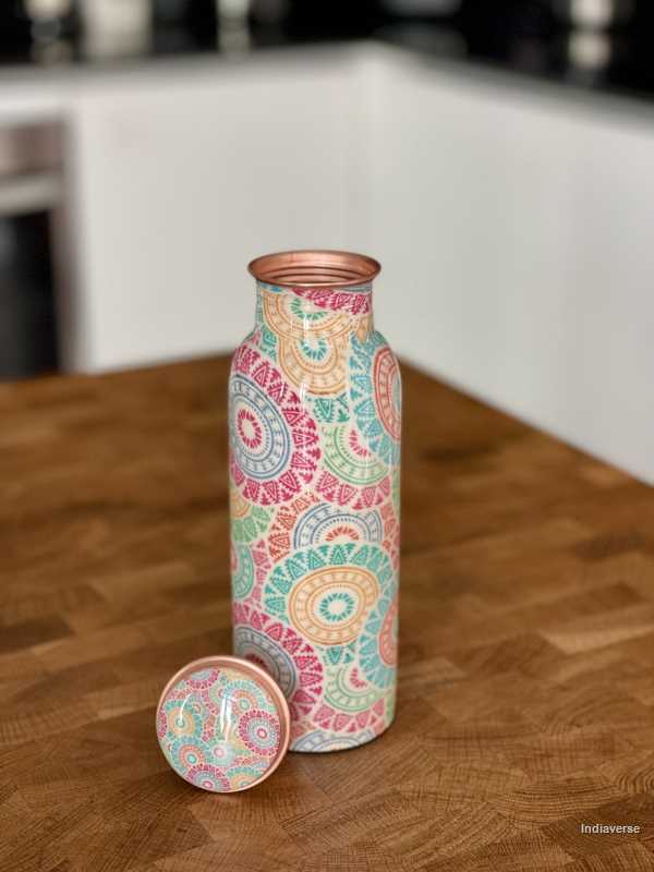 pastel colored enameled copper bottle with lid and with colorful ethnic design for drinking water up to 600 ml capacity