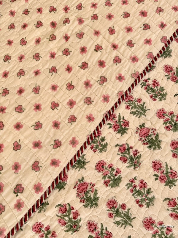 Close up of the floral print on white background and the reverse side of the comforter
