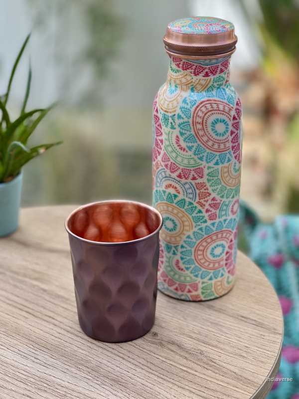 polished copper cup with hammered diamond shape details made for serving water and healthy alternative to glass