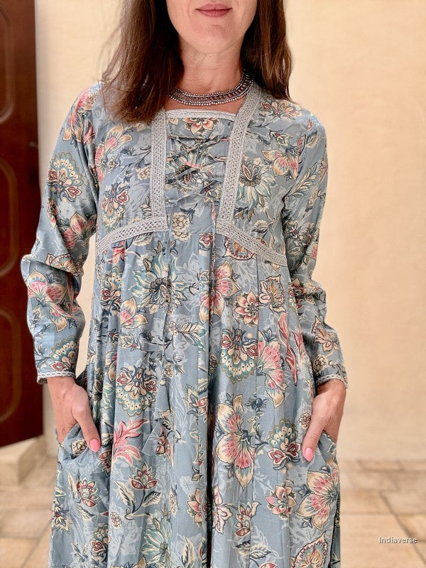 Woman wearing a floral dress with a beige background