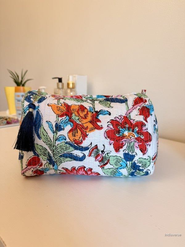 A fabric cosmetic pouch with a colorful floral print on a white  | Flower Bouquet