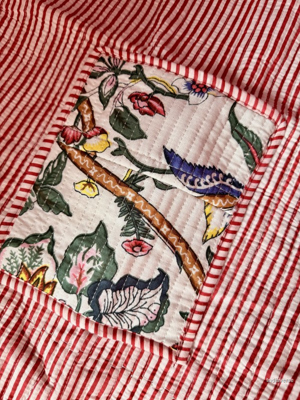 stripe design and inside pocket with floral design of the quilted tote bag