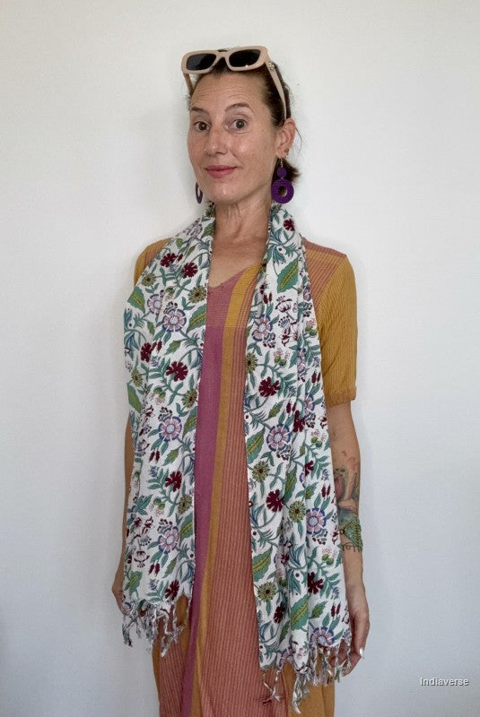 woman wearing a cotton scarf with floral design