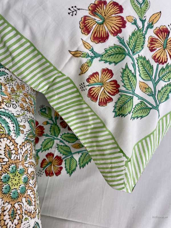 Included in the green red floral bedding set a flat sheet and two pillowcases in pure cotton and hand block printed