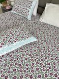 Included in the turquoise set Purple Wisteria a flat sheet and two pillowcases in pure cotton and handblock printed