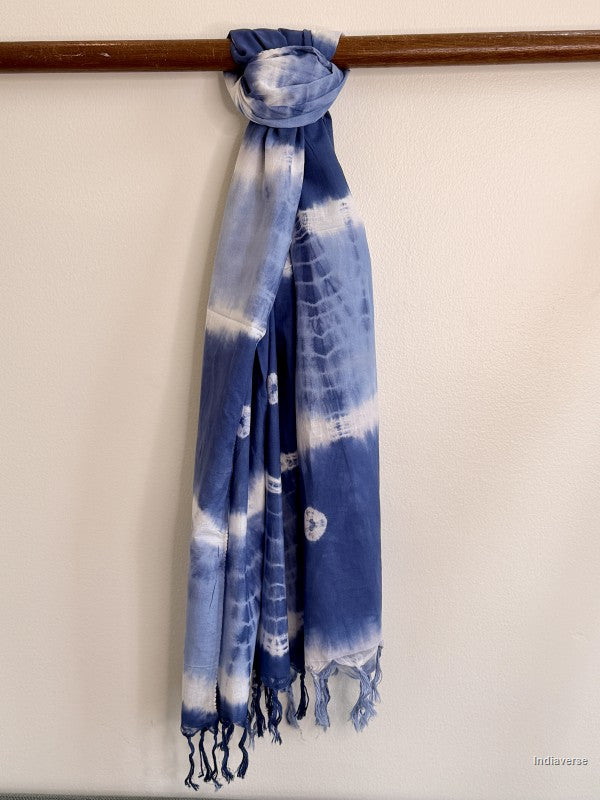 cotton scarf in indigo blue tied to a wooden beam