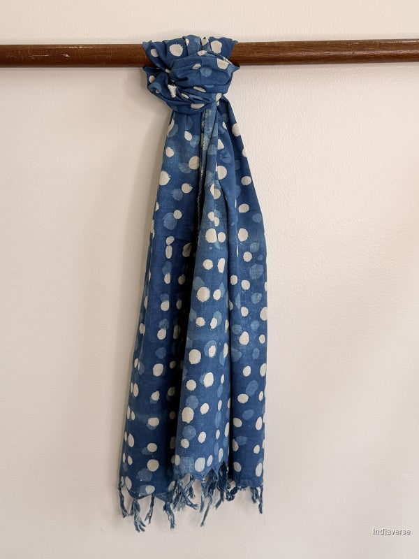 indigo blue cotton scarf tied to a wooden beam