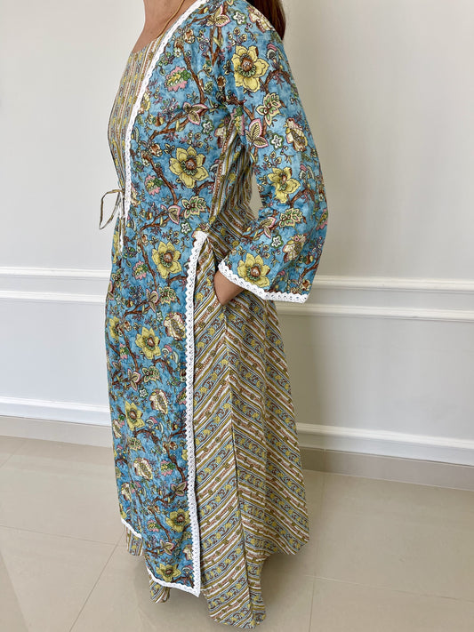 Long-cotton-dress-two-layered-look-with-white-lace-border-detail-and-blue-beige-yellow-floral-design-and-full-length-sleeves