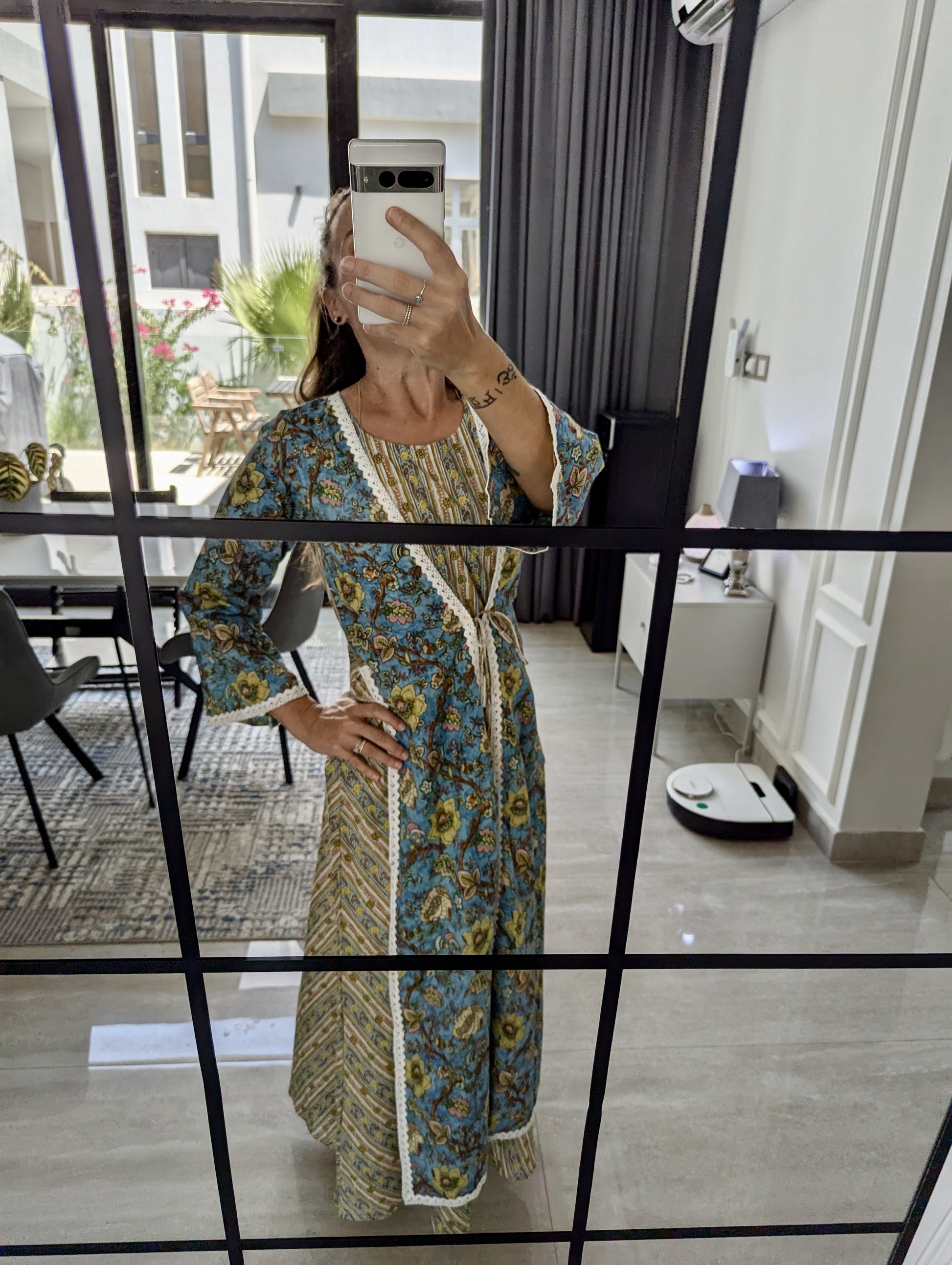 Long-cotton-dress-two-layered-look-with-white-lace-border-detail-and-blue-beige-yellow-floral-design-and-full-length-sleeves