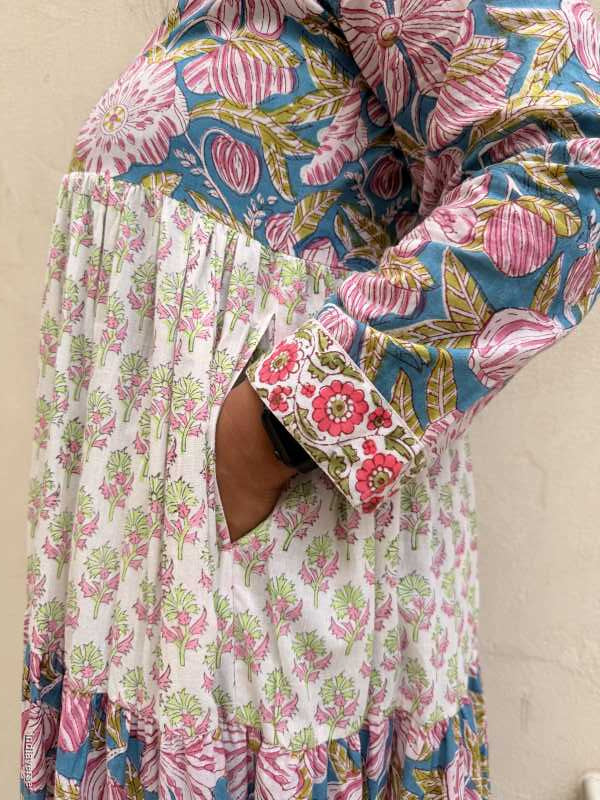 Close up of cotton maxi dress showing the hand inside the dress pocket 