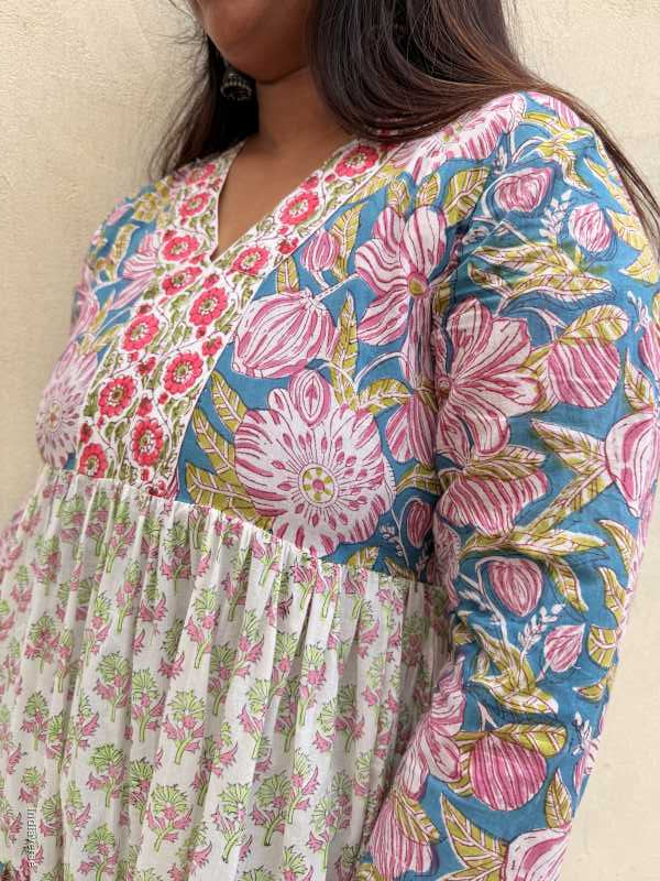 Woman wearing a colorful floral dress close up photo of the chest part