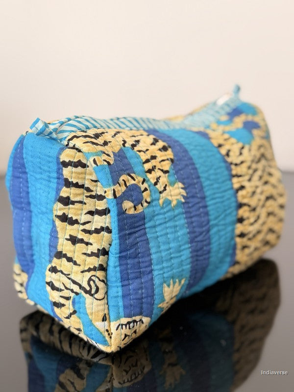 Textile roll with blue and yellow pattern on a reflective surface