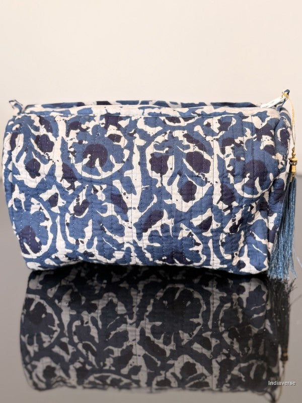 Two patterned pouches stacked on a light gray background