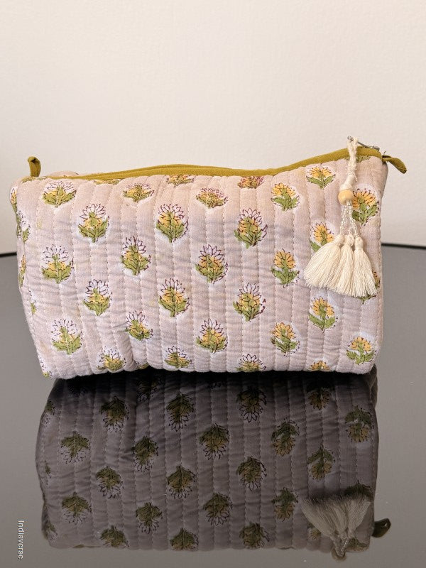 Two fabric bags with floral patterns on a plain background