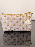 Two fabric bags with floral patterns on a plain background
