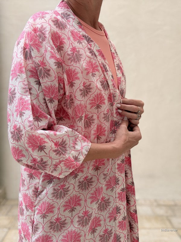 close up of woman wearing a midi size kimono with pink lotus print 