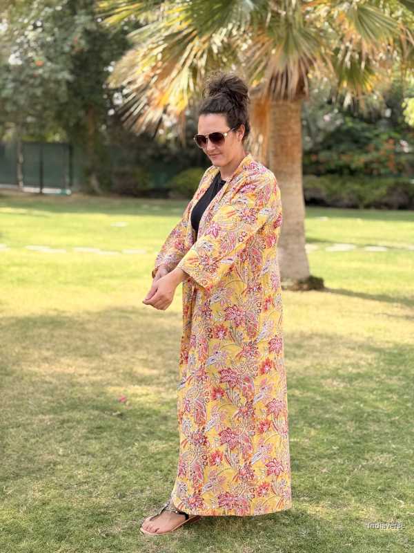 Woman wearing a floral kimono in a park setting