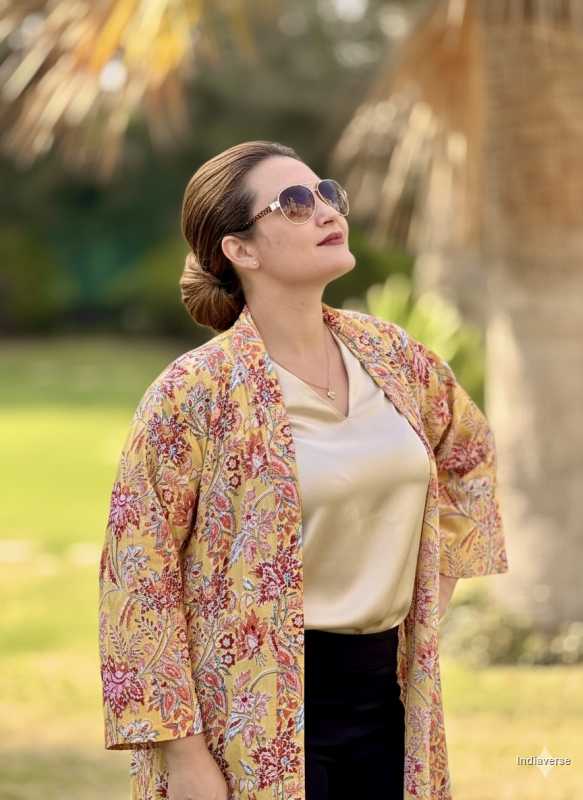 Woman wearing a floral kimono in an outdoor setting