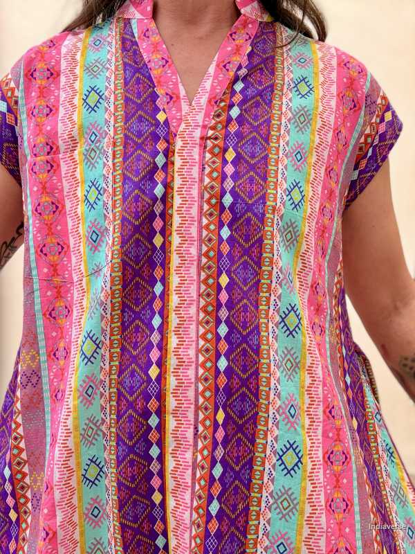 Colorful patterned dress with a geometric design on a plain background
