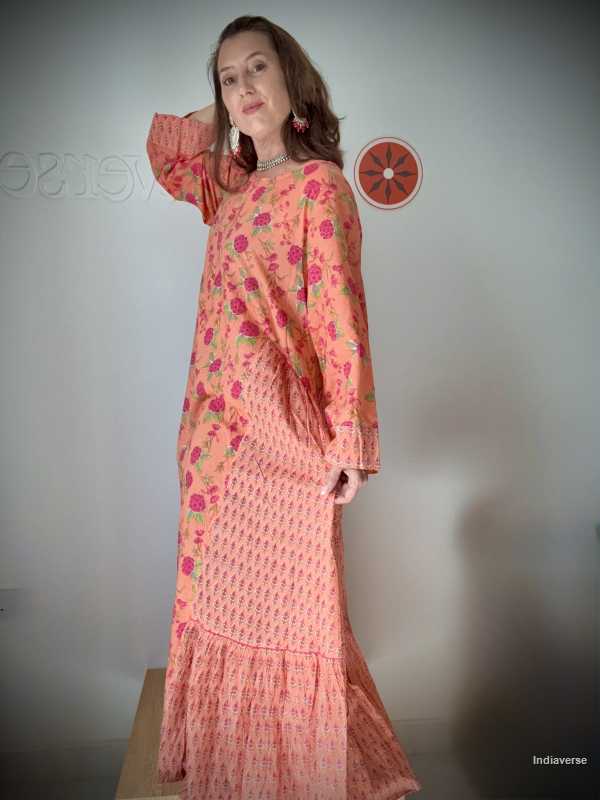 Woman wearing a floral dress with a plain background