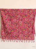 cotton scarf with pink rose design hanging from a wooden beam