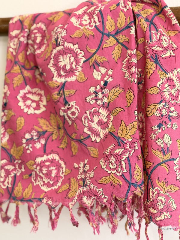 close up of a pink cotton scarf with floral design