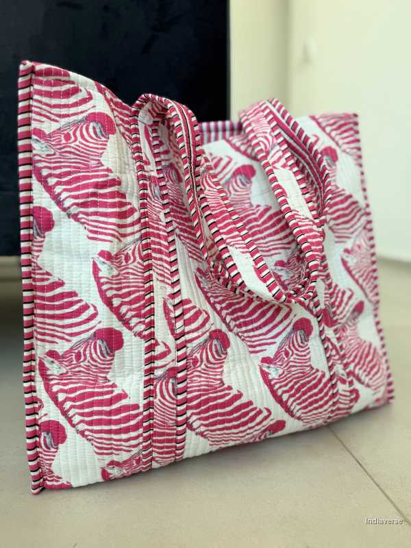 cotton tote bag with pink zebra design sitting on a tile floor