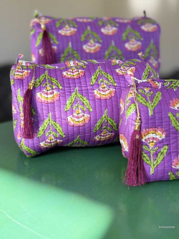 Toiletry Pouch Set with symmetric flower design and purple background in three different sizes for toiletries and cosmetics | Purple Flowers