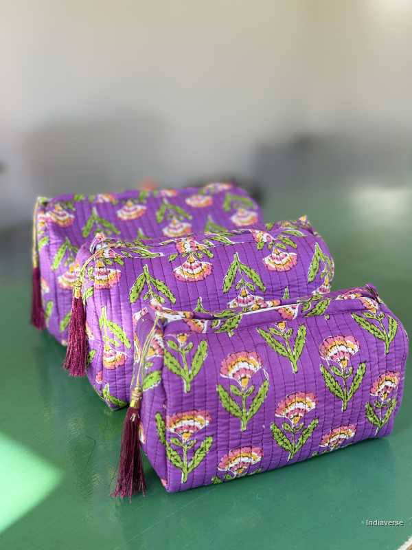Toiletry Pouch Set with symmetric flower design and purple background in three different sizes for toiletries and cosmetics | Purple Flowers