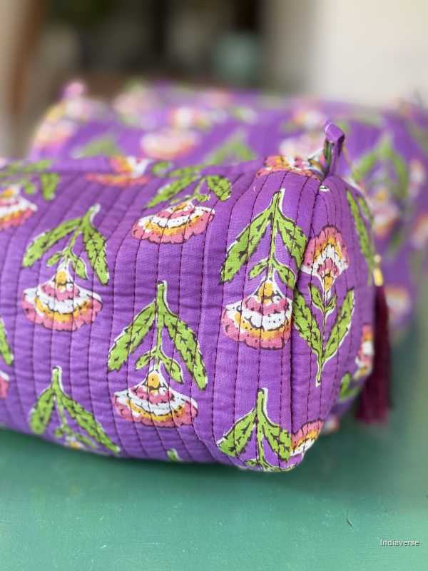 Toiletry Pouch Set with symmetric flower design and purple background in three different sizes for toiletries and cosmetics | Purple Flowers