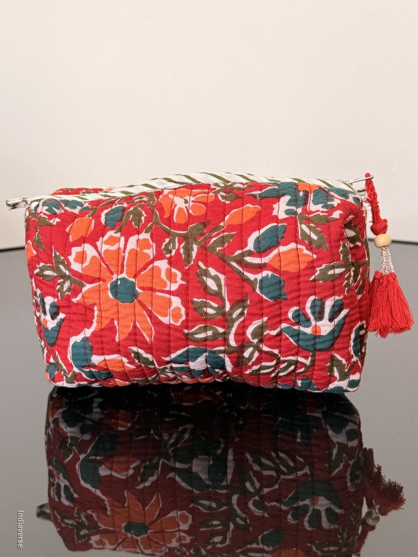 Two fabric bags with floral patterns on a plain background