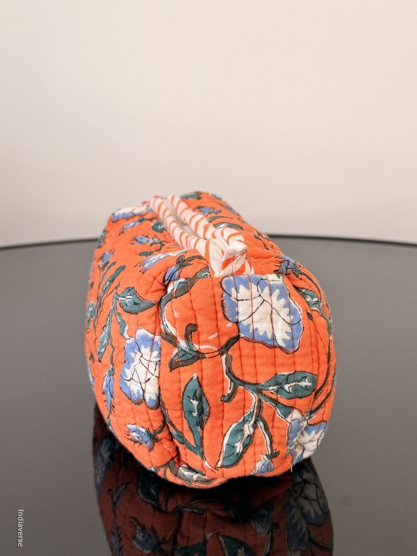 Floral-patterned fabric roll on a neutral background