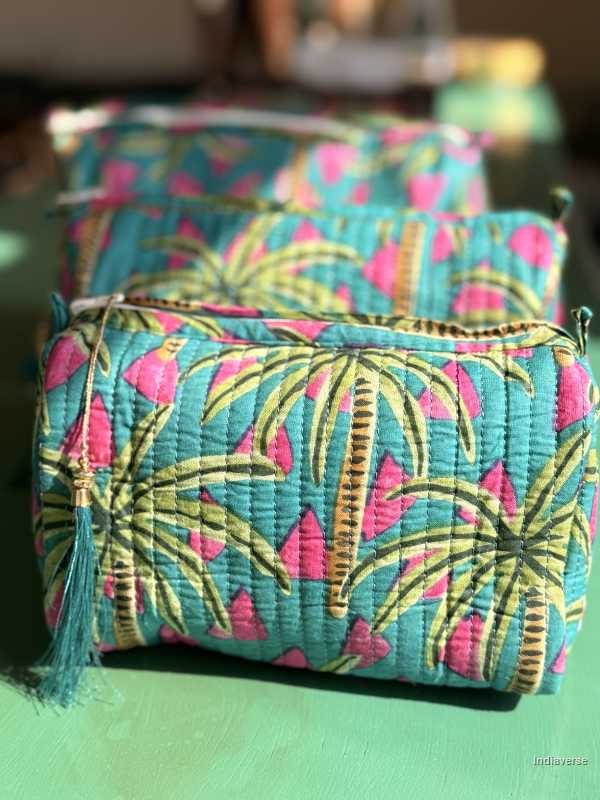 Colorful fabric pouch with tropical pattern on a green surface | Tropical Bliss