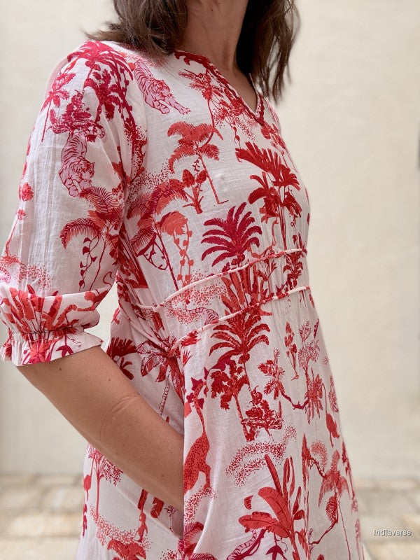 Red and white floral patterned dress worn by a person.