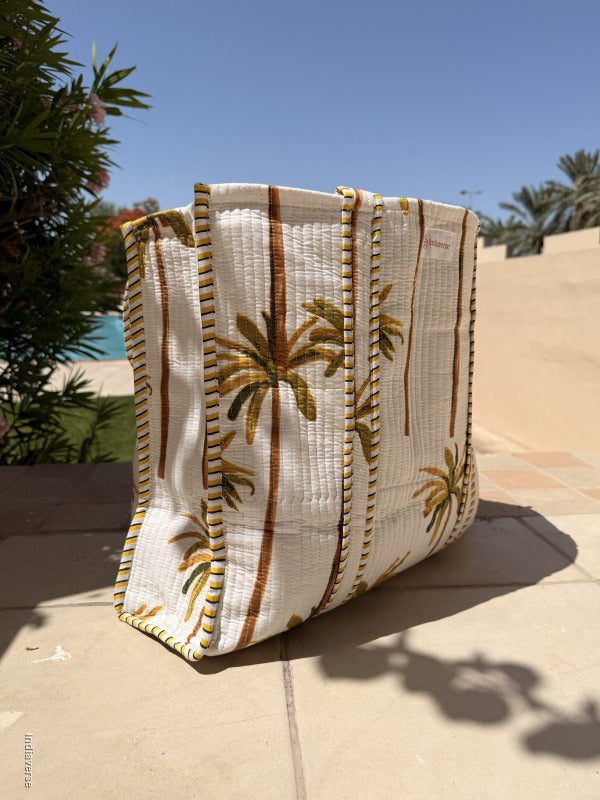 Textile with floral patterns draped over a surface outdoors