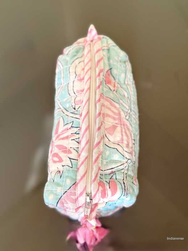 baby blue toiletry bag with pink lotus flowers view from above | Aqua Lotus