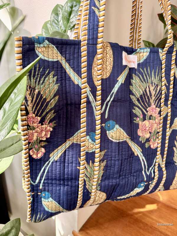 tropical royal blue tote bag with bird and pineapple design hanging