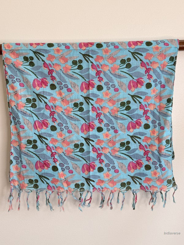 blue cotton scarf with floral design hanging over a wooden beam