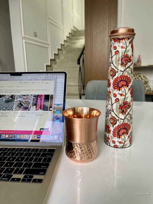 polished copper cup with hammered details made for serving water and healthy alternative to glass